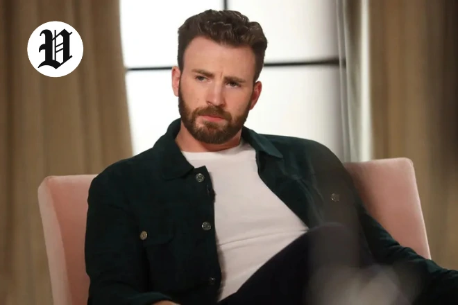 Chris Evans in a dark green jacket sitting during an interview