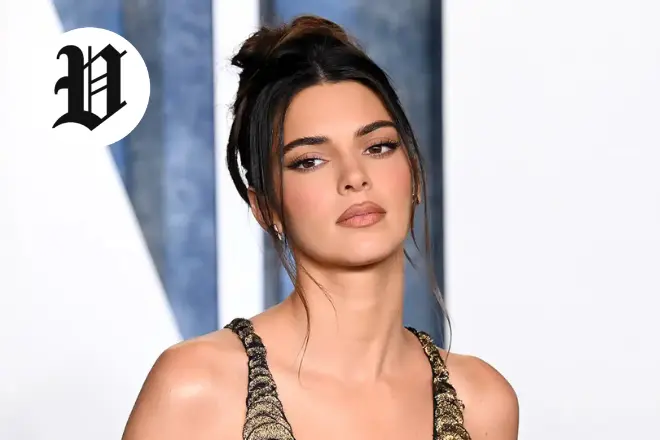 Kendall Jenner on the red carpet in a glamorous gown.