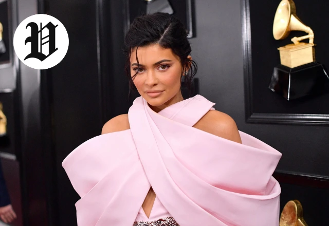 : Kylie Jenner wearing a dramatic pink gown on the red carpet