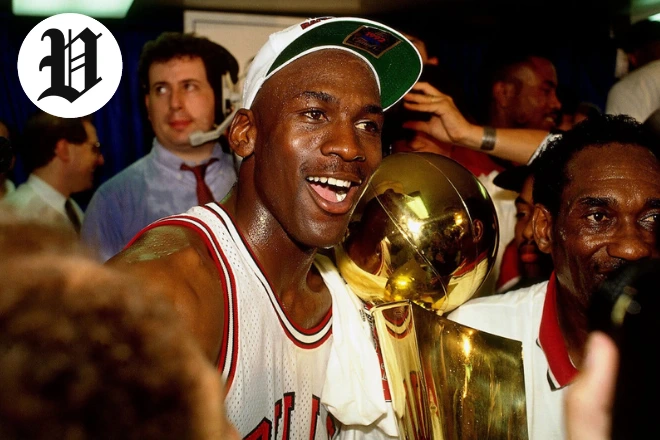 Michael Jordan celebrating NBA championship with trophy – Michael Jordan Net Worth legacy