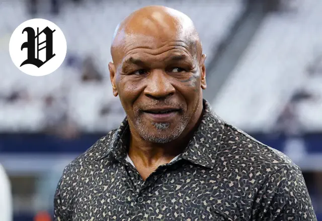 Mike Tyson Biography – Mike Tyson smiling in casual attire