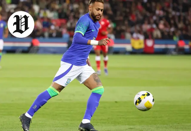 : Neymar Jr dribbling the ball in Brazil national team kit during a match.