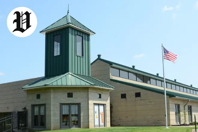 Exterior view of Pavilion Georgetown building with green roof and American flag.