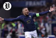 Kylian Mbappé celebrates after scoring a goal for France.