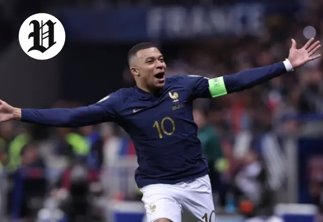 Kylian Mbappé celebrates after scoring a goal for France.