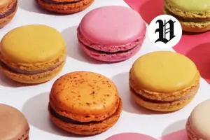 : Assorted colorful French macarons on a pink background – Best Desserts in Las Vegas.