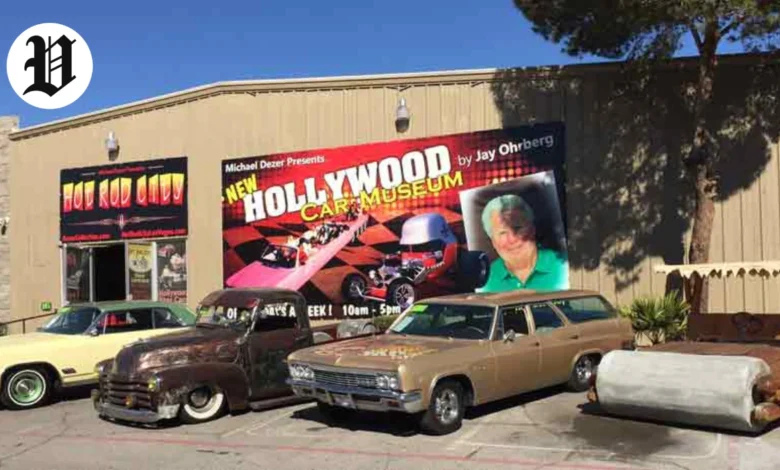 Exterior view of the Hollywood Car Museum in Las Vegas with classic cars parked outside.