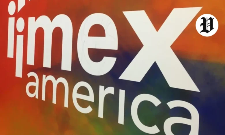IMEX America event signage with bold branding and vibrant colors