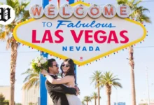 Newlywed couple celebrating under the Welcome to Fabulous Las Vegas sign – Married in Las Vegas.