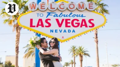 Newlywed couple celebrating under the Welcome to Fabulous Las Vegas sign – Married in Las Vegas.