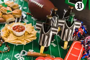 Super Bowl watch parties in Las Vegas snacks with beer bottles, nachos, sliders, and football décor on a game-day table.