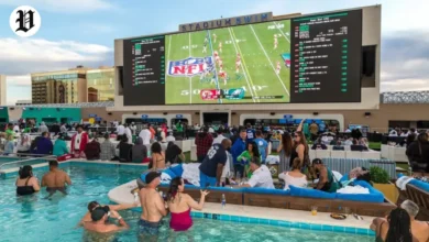 People enjoying a rooftop poolside Super Bowl watch parties in Las Vegas. at Stadium Swim