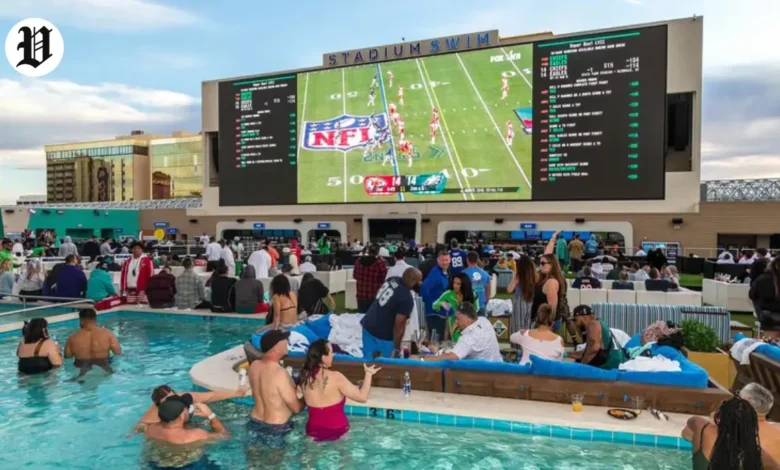 People enjoying a rooftop poolside Super Bowl watch parties in Las Vegas. at Stadium Swim