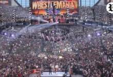 WrestleMania Las Vegas ring and massive entrance stage under stadium roof, surrounded by fans