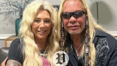 Francie Frane sitting beside Duane Chapman, smiling together in a casual indoor setting.