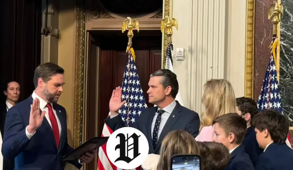 Pete Hegseth raising his hand during his official swearing-in ceremony.