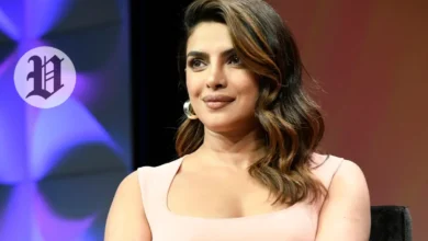 Priyanka Chopra speaking at an event wearing a light pink dress